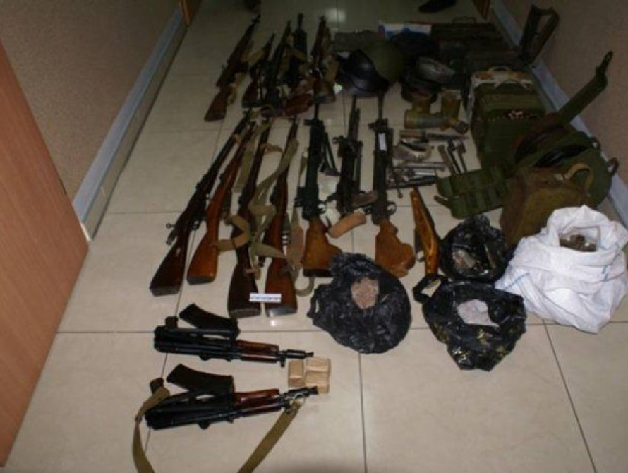 В Мелитополе СБУ задержали торговцев оружием с флагами России